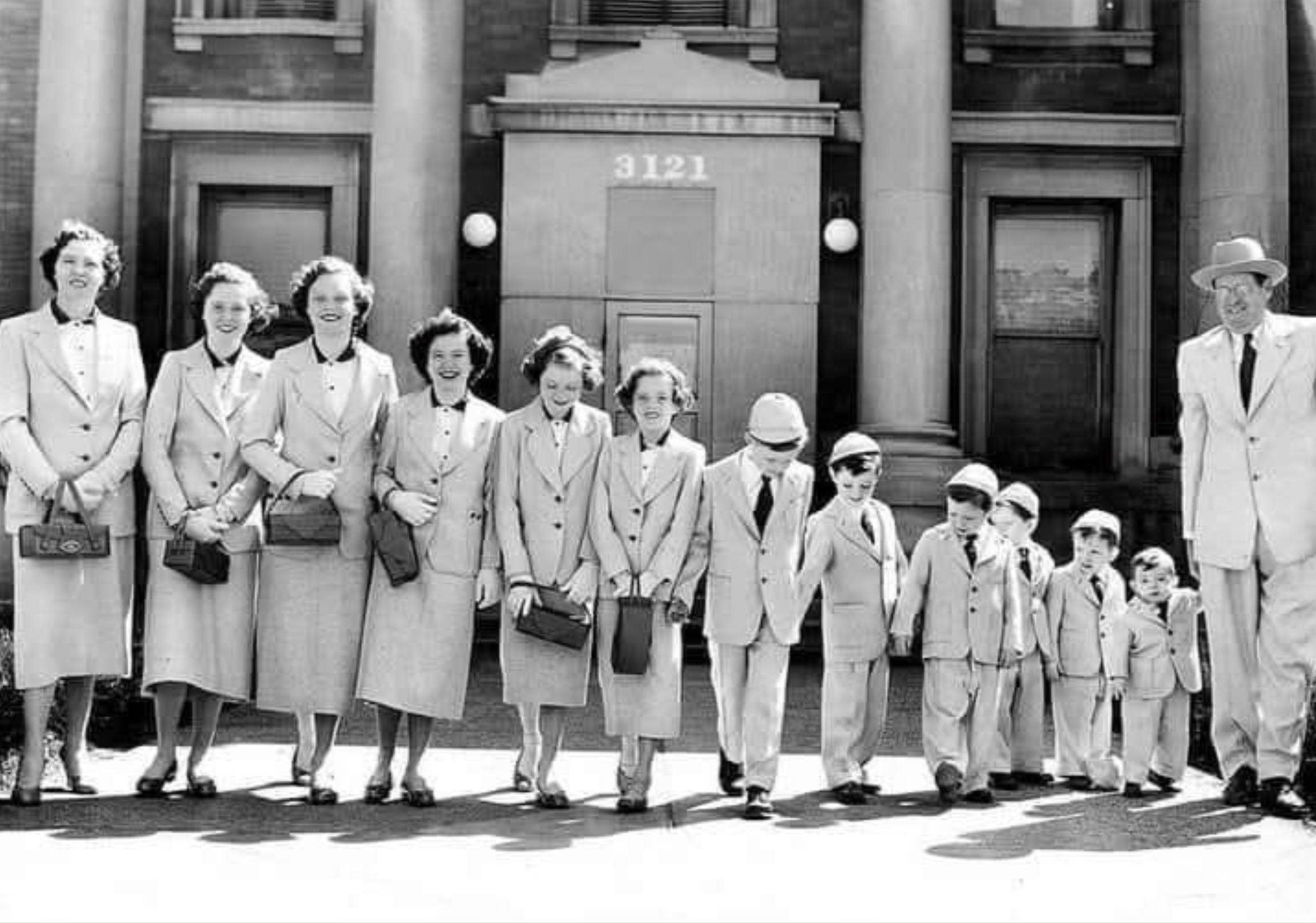 husband and wife with their 11 children palm sunday 1954 - 3121